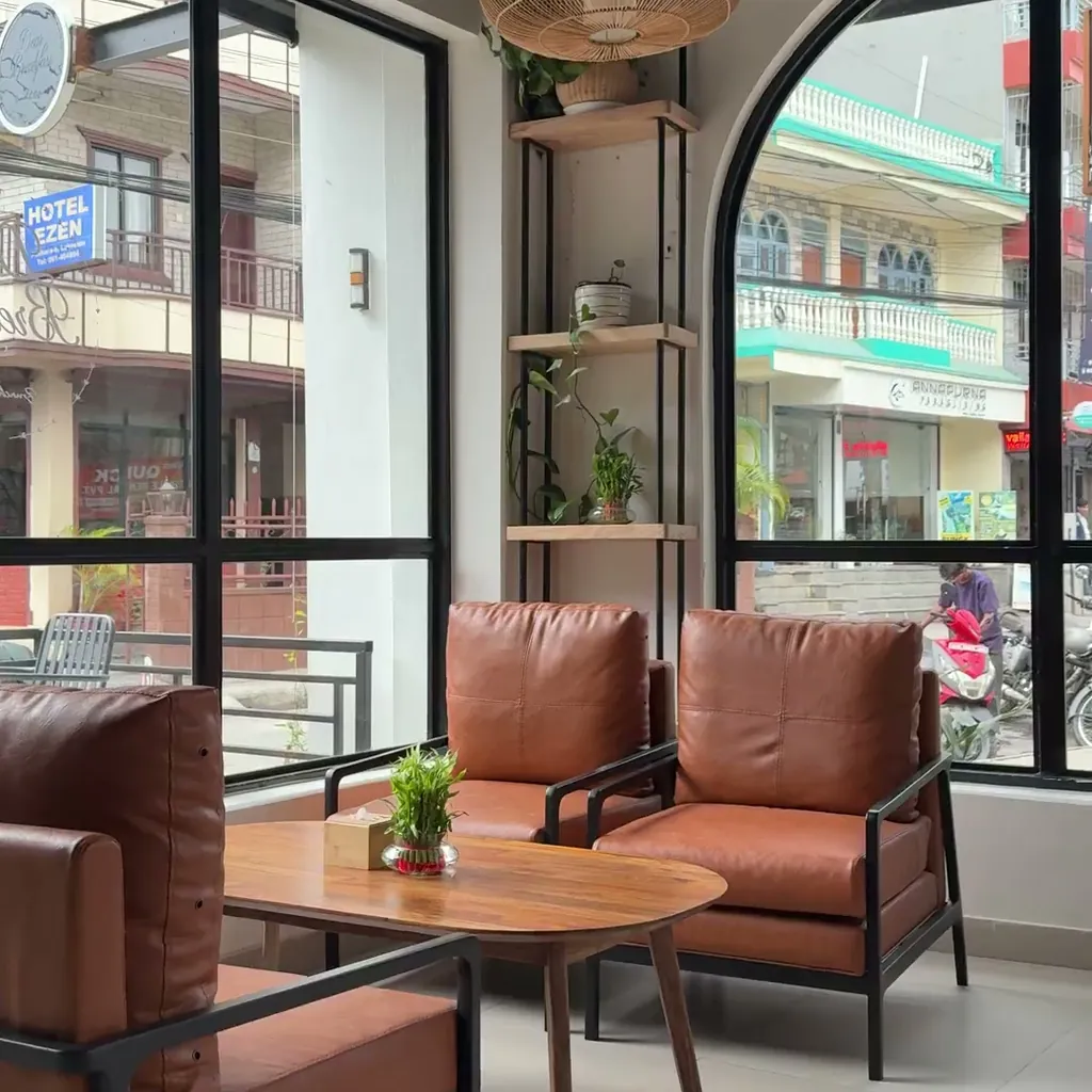 A quiet seating corner with leather chairs inside Dear Breakfast, Lakeside Pokhara
